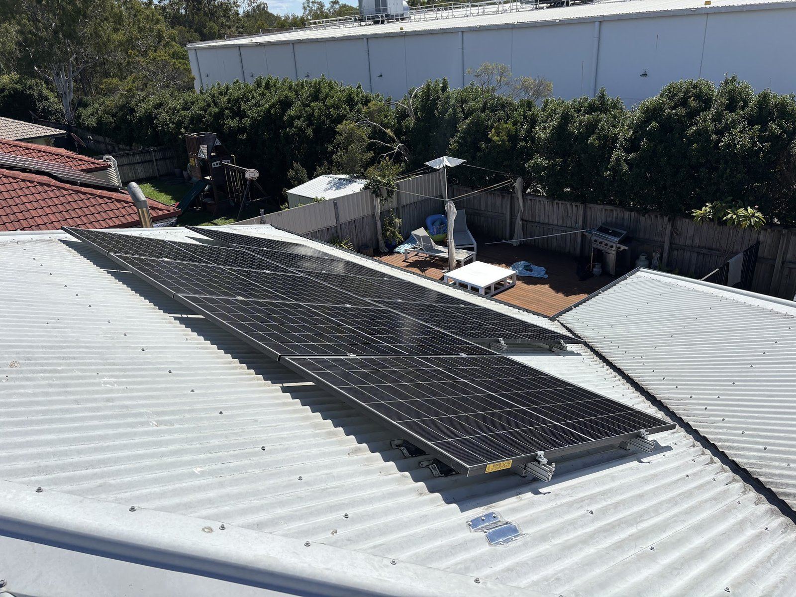 Full solar array on white Colorbond roof