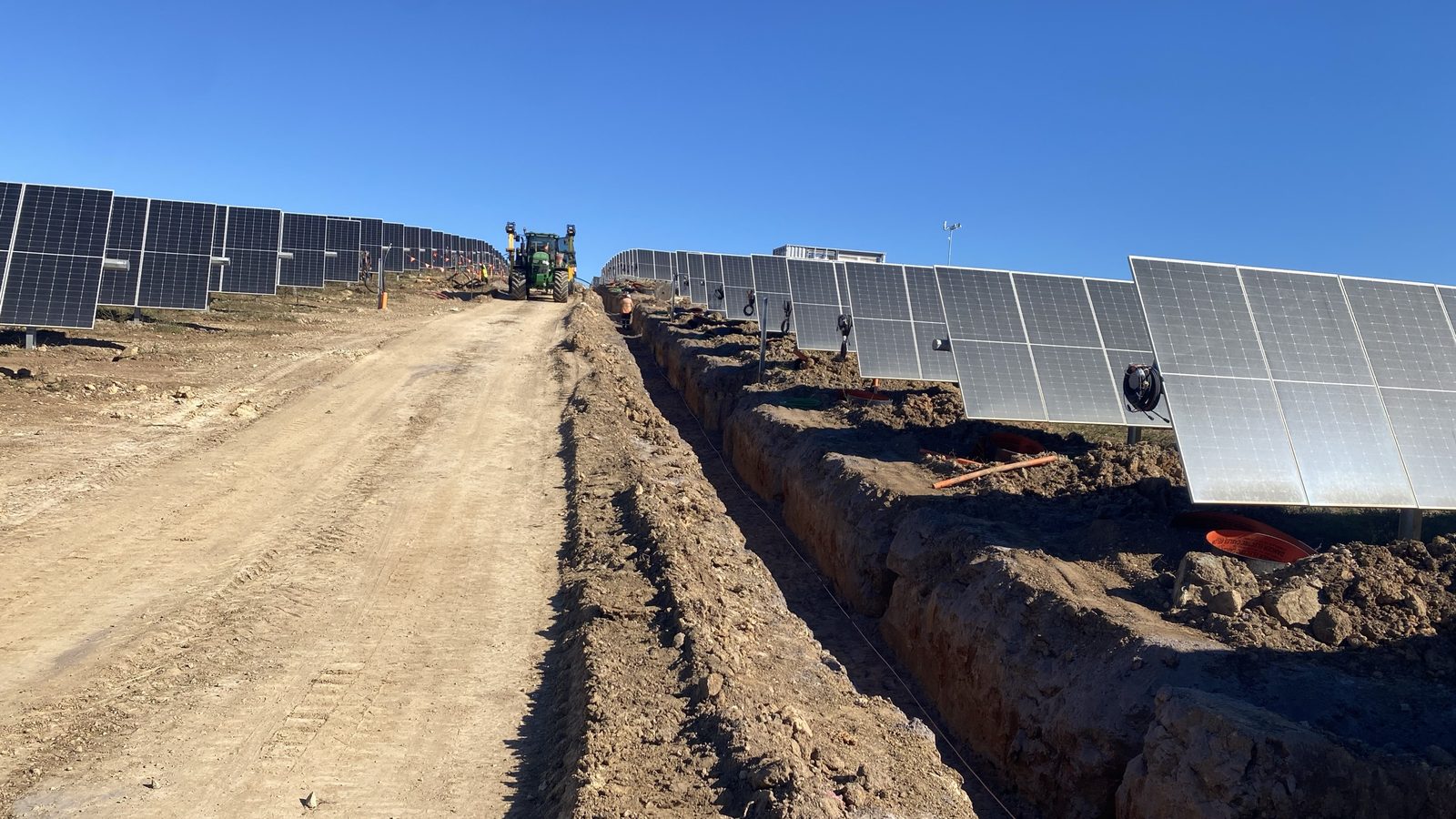 DC cable trench, conduit and draw pits alongside tracker rows at Bundaberg Solar Farm