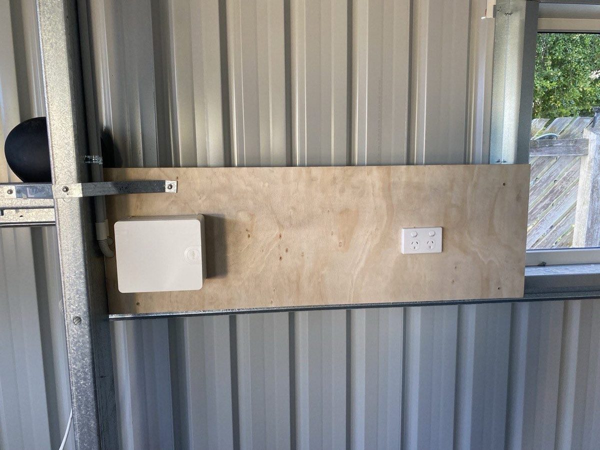 Shed job — plywood backing board with enclosure and double power point
